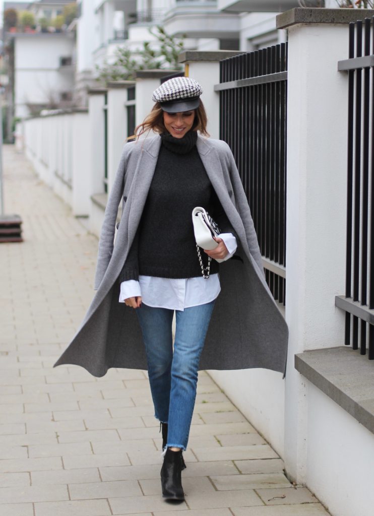 DÜSSELDORF; GERMANY - JANUARY : German model and fashion blogger Alexandra Lapp (@alexandralapp_) wearing western boots from Nubikk, high waist denim from Levi's, a white shirt and a grey cashmere coat by Céline, black and white bag from Chanel, hat from Eugenia Kim and cashmere knitwear by Loro Piana on January, 2017 in Germany*** Local Caption *** Alexandra Lapp