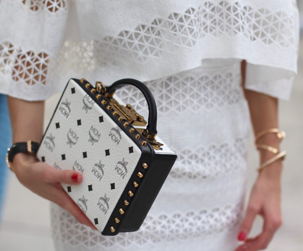 MIAMI; FLORIDA - JANUARY : German model and fashion blogger Alexandra Lapp (@alexandralapp_) wearing a MCM Berlin crossbody bag in black and white, Isla off the shoulder dress in white, Saint Laurent pumps, an IWC watch and cat eye sunglasses by Prada on January, 2017 in Miami *** Local Caption *** Alexandra Lapp