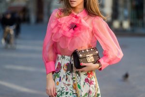 FLORENCE, ITALY - JANUARY 11: German fashion blogger and model Alexandra Lapp is wearing a black Padlock shoulder bag by Gucci , a pink blouse by Gucci, pleated Flora snake, silk skirt by Gucci, sunglasses from Celine, black Christian Louboutin pumps on January 11, 2017 in Florence, Italy. (Photo by Christian Vierig/Getty Images) *** Local Caption *** Alexandra Lapp