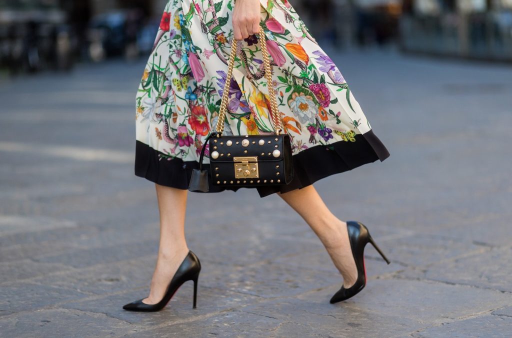 FLORENCE, ITALY - JANUARY 11: German fashion blogger and model Alexandra Lapp is wearing a black Padlock shoulder bag by Gucci , a pink blouse by Gucci, pleated Flora snake, silk skirt by Gucci, sunglasses from Celine, black Christian Louboutin pumps on January 11, 2017 in Florence, Italy. (Photo by Christian Vierig/Getty Images) *** Local Caption *** Alexandra Lapp