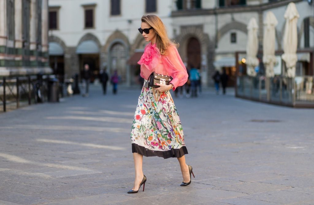 FLORENCE, ITALY - JANUARY 11: German fashion blogger and model Alexandra Lapp is wearing a black Padlock shoulder bag by Gucci , a pink blouse by Gucci, pleated Flora snake, silk skirt by Gucci, sunglasses from Celine, black Christian Louboutin pumps on January 11, 2017 in Florence, Italy. (Photo by Christian Vierig/Getty Images) *** Local Caption *** Alexandra Lapp