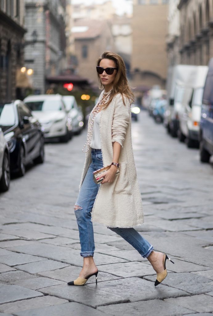 FLORENCE, ITALY - JANUARY 11: German fashion blogger and model Alexandra Lapp, wearing a Levi's RE/DONE jeans, a tank top by Jadicted, a white, classic coat from Oui Fashion, white pearls and sunglasses with pearls from Chanel and Chanel mules and clutch on January 11, 2017 in Florence, Italy. (Photo by Christian Vierig/Getty Images) *** Local Caption *** Alexandra Lapp
