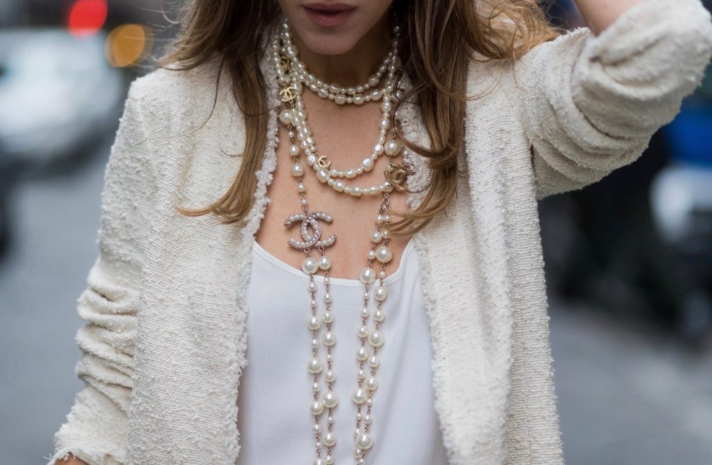 FLORENCE, ITALY - JANUARY 11: German fashion blogger and model Alexandra Lapp, wearing a Levi's RE/DONE jeans, a tank top by Jadicted, a white, classic coat from Oui Fashion, white pearls and sunglasses with pearls from Chanel and Chanel mules and clutch on January 11, 2017 in Florence, Italy. (Photo by Christian Vierig/Getty Images) *** Local Caption *** Alexandra Lapp