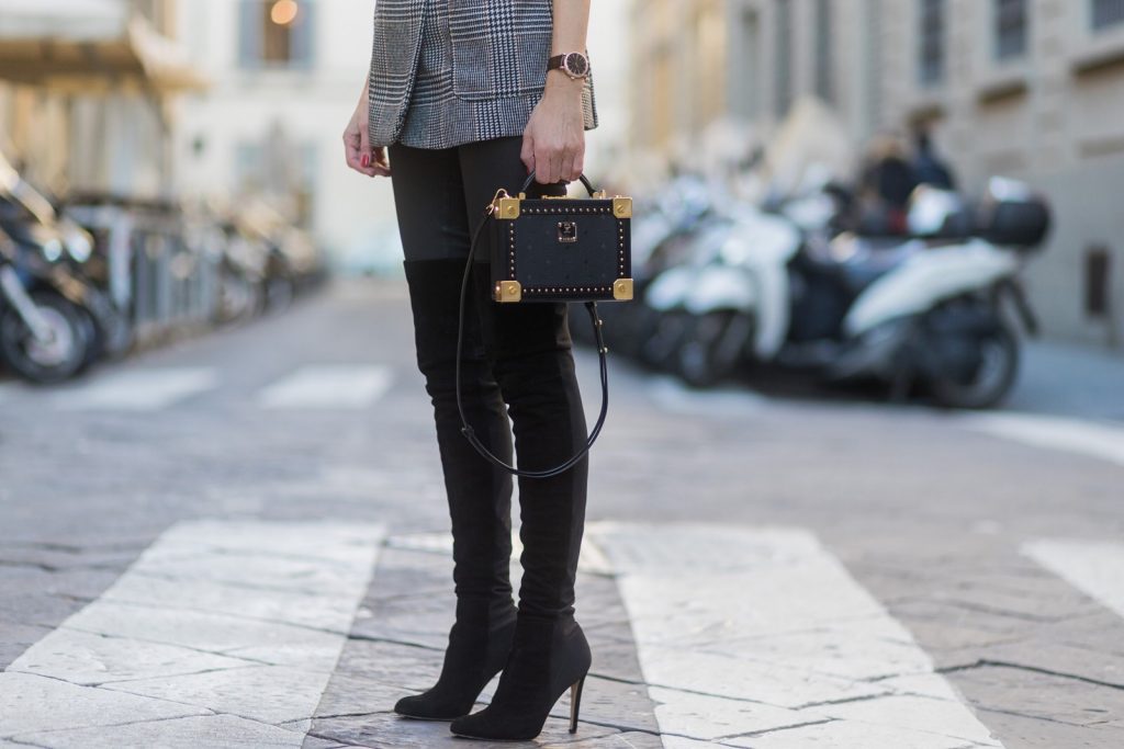 FLORENCE, ITALY - JANUARY 11: German fashion blogger and model Alexandra Lapp is wearing leather pants from Set, suede overknee boots in black by Gianvito Rossi, off white silk top from Jadicted, straight-cut, double-breasted jacket in woven fabric with two front pockets and a double back vent from H&M, Hermes women's leather belt in black Epsom calfskin, Kelly buckle in palladium plated gold metal, bag MCM small Berlin Crossbody, Ray-Ban Clubmaster sunglasses on January 11, 2017 in Florence, Italy. (Photo by Christian Vierig/Getty Images) *** Local Caption *** Alexandra Lapp