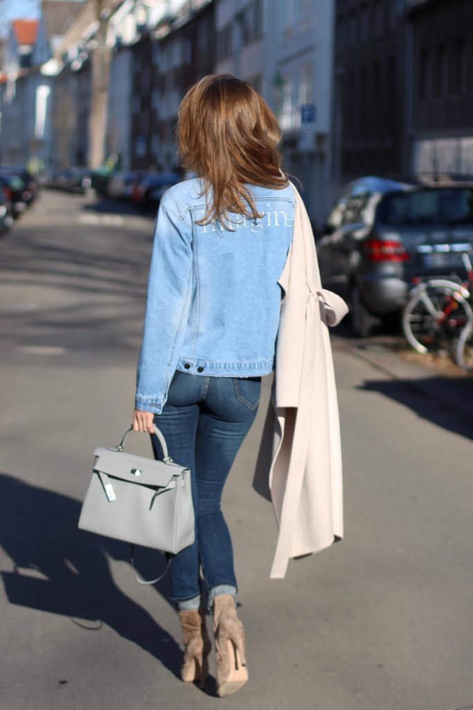 DÜSSELDORF, GERMANY - FEBRUARY 14: German fashion blogger and model Alexandra Lapp is wearing double denim - a light blue denim jacket by SET, slim fit high waist denim from Rag and Bone, off white knitwear from Oui, Hermes Kelly bag in light grey, Le Specs sunglasses, beige velvet booties from Gianvito Rossi and a light beige wool coat from Steffen Schraut on February 14, 2017 Düsseldorf, Germany. *** Local Caption *** Alexandra Lapp