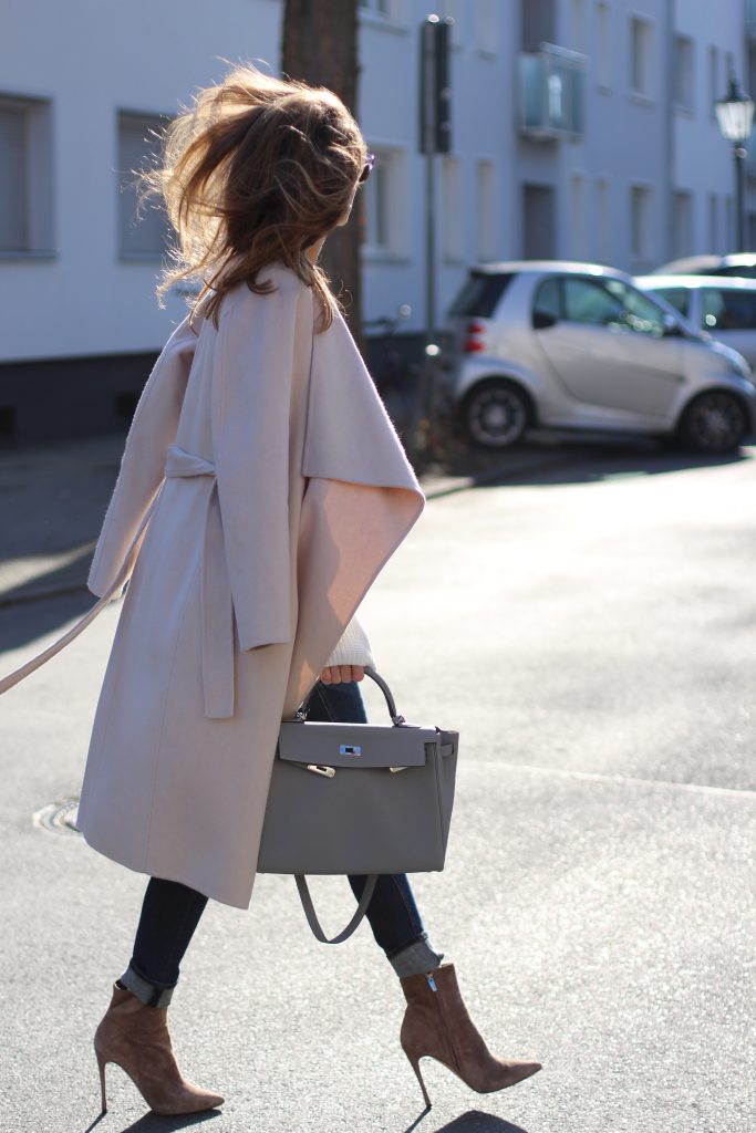 DÜSSELDORF, GERMANY - FEBRUARY 14: German fashion blogger and model Alexandra Lapp is wearing double denim - a light blue denim jacket by SET, slim fit high waist denim from Rag and Bone, off white knitwear from Oui, Hermes Kelly bag in light grey, Le Specs sunglasses, beige velvet booties from Gianvito Rossi and a light beige wool coat from Steffen Schraut on February 14, 2017 Düsseldorf, Germany. *** Local Caption *** Alexandra Lapp