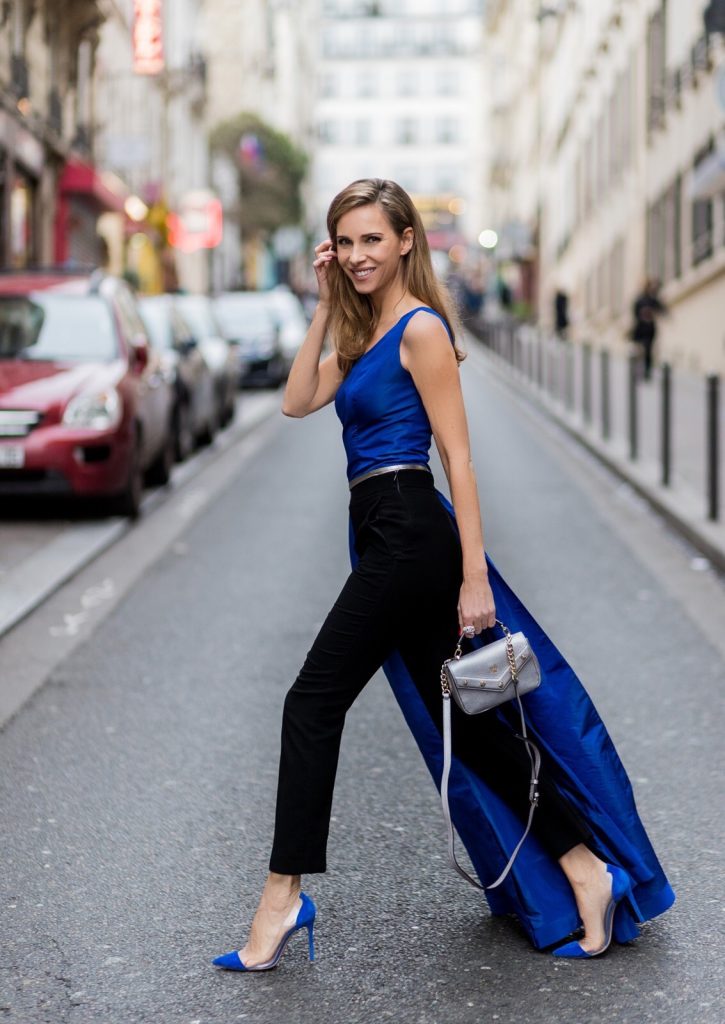 asymmetric one-shoulder silhouette, MCM, Pearl & Rubies, Cartier, Gianvito Rossi, Paris, France, PFW PARIS; FRANCE; Model and Blogger Alexandra Lapp wearing asymmetric one shoulder silhouette, blue taffeta and leather top from Pearl and Rubies with a skin barring asymmetric one-shoulder Silhouette, Black pants from Pearl and Rubies, Blue suede plexi pumps from Gianvito Rossi, Catherine shoulder mini bag in silver from MCM on March 4, 2017 in Paris, France.