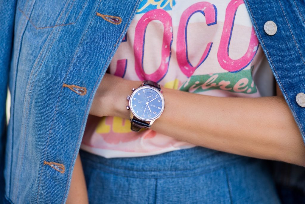 PARIS; FRANCE; during PFW, Blogger and Model Alexandra Lapp wearing a Statement shirt, a colorful graphic T-Shirt from Chanel Cuba Cruise 2017 collection, A-line denim skirt from Balmain, trucker denim Jacket from Levis, two tone pumps in oasis green with a silver toe cap in 10cm from Manolo Blahnik, Bag MCM Milla bag, Sunglasses by Les Specs on March 3, 2017 in Paris, France.