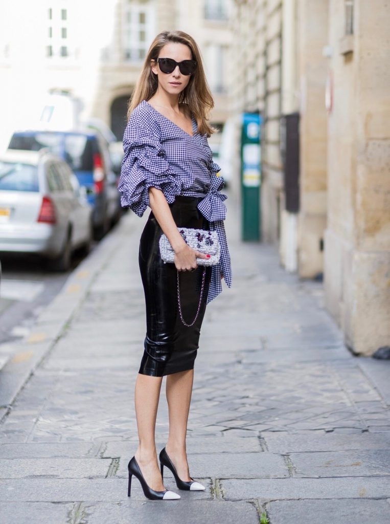 Atsuko Kudo, Latex, latex skirt, Storets, ruched sleeve top, Chanel, Saint Laurent, IWC, Celine, Paris, PFW PARIS; FRANCE; Model and Blogger Alexandra Lapp wearing latex skirt and ruched sleeve top, a black Couture Latex Crystal pencil Skirt from Atsuko Kudo, Pepita blouse top from Storets with black and white check print, Decollete neckline and riches sleeve Black and white pumps from Saint Laurent, Oversized Audrey sunglasses from Celine, Black and white 2.55 bag in tweed from Chanel on March 3, 2017 in Paris, France.
