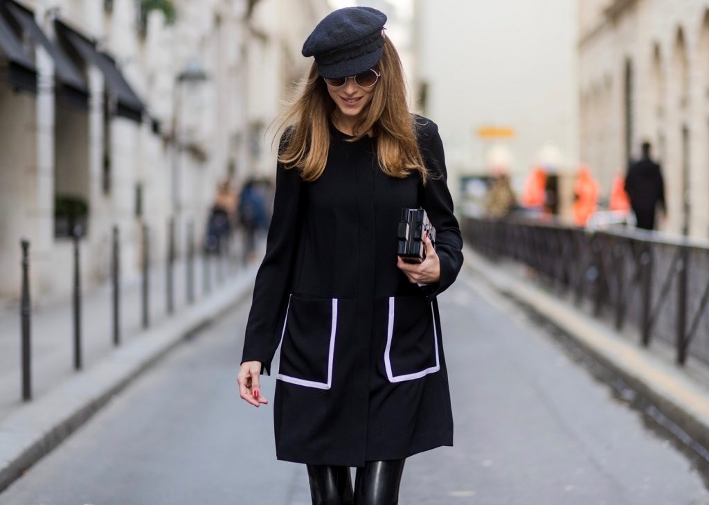 PARIS; FRANCE; RUE CAMBON; Model and Blogger Alexandra Lapp wearing black Couture Latex socks from Atsuko Kudo, coat from Steffen Schraut, Pumps by Saint Laurent, Cap from Chanel, Chanel Lego Brique (brick) bag in black and white, Sunglasses by Chromehearts on March 3, 2017 in Paris, France.