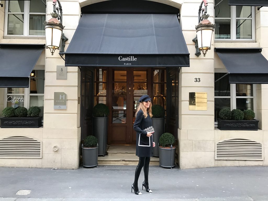 PARIS; FRANCE; RUE CAMBON; Model and Blogger Alexandra Lapp wearing black Couture Latex socks from Atsuko Kudo, coat from Steffen Schraut, Pumps by Saint Laurent, Cap from Chanel, Chanel Lego Brique (brick) bag in black and white, Sunglasses by Chromehearts on March 3, 2017 in Paris, France.