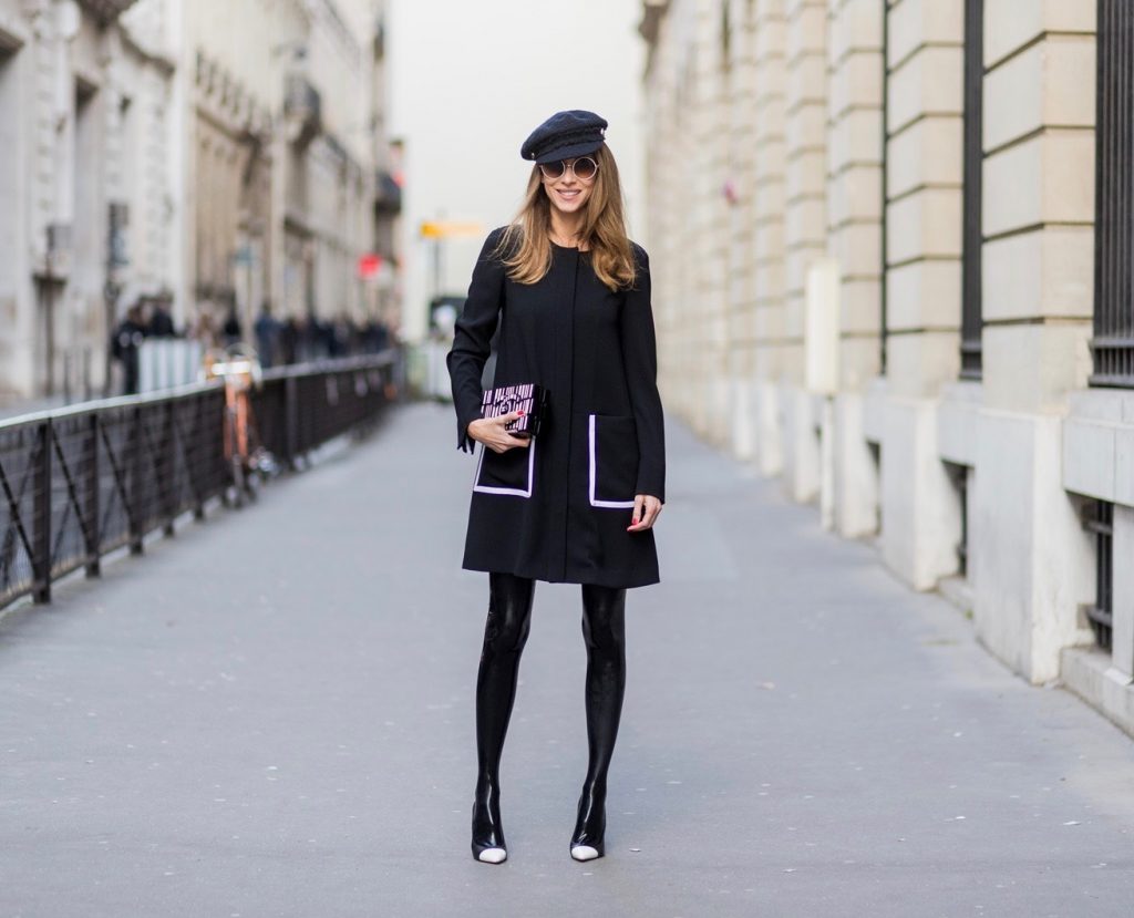 PARIS; FRANCE; RUE CAMBON; Model and Blogger Alexandra Lapp wearing black Couture Latex socks from Atsuko Kudo, coat from Steffen Schraut, Pumps by Saint Laurent, Cap from Chanel, Chanel Lego Brique (brick) bag in black and white, Sunglasses by Chromehearts on March 3, 2017 in Paris, France.
