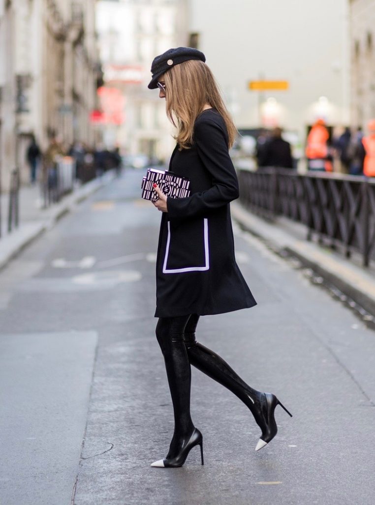 PARIS; FRANCE; RUE CAMBON; Model and Blogger Alexandra Lapp wearing black Couture Latex socks from Atsuko Kudo, coat from Steffen Schraut, Pumps by Saint Laurent, Cap from Chanel, Chanel Lego Brique (brick) bag in black and white, Sunglasses by Chromehearts on March 3, 2017 in Paris, France.
