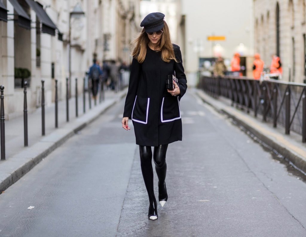 PARIS; FRANCE; RUE CAMBON; Model and Blogger Alexandra Lapp wearing black Couture Latex socks from Atsuko Kudo, coat from Steffen Schraut, Pumps by Saint Laurent, Cap from Chanel, Chanel Lego Brique (brick) bag in black and white, Sunglasses by Chromehearts on March 3, 2017 in Paris, France.