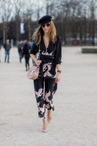 PARIS; FRANCE; during PFW, Model and Blogger Alexandra Lapp wearing Sleepwear to Daywear, Printed jacket with contrasting sash belt, lapel collar and long sleeves from Zara in black with rose birds, Matching flowing printed culottes from Zara in black with rose birds, Christian Louboutin nude lacquer pumps, nude Drew small leather cross-body bag by Chloe, Cap from Chanel, Sunglasses by Chloe on March 3, 2017 in Paris, France.