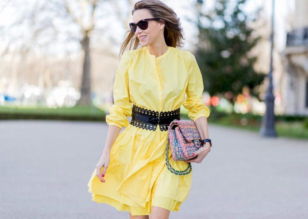 yellow sunshine dress, Marc Cain, Alaïa, Sophia Webster, Chanel, IWC PARIS, FRANCE - MARCH 03: Alexandra Lapp wearing a yellow sunshine dress by Marc Cain, loose-fitting dress with flounce-like tiers, narrow, single-buttoned,(waist belt) Azzedine Alaia, Chiara Butterfly style sandals from Sophia Webster ( printed Butterfly Wing sandal, finished with a silver mirror front strap), cat eye sunglasses with pearls from Chanel, Chanel bag on March 3, 2017 in Paris, France. (Photo by Christian Vierig/Getty Images)