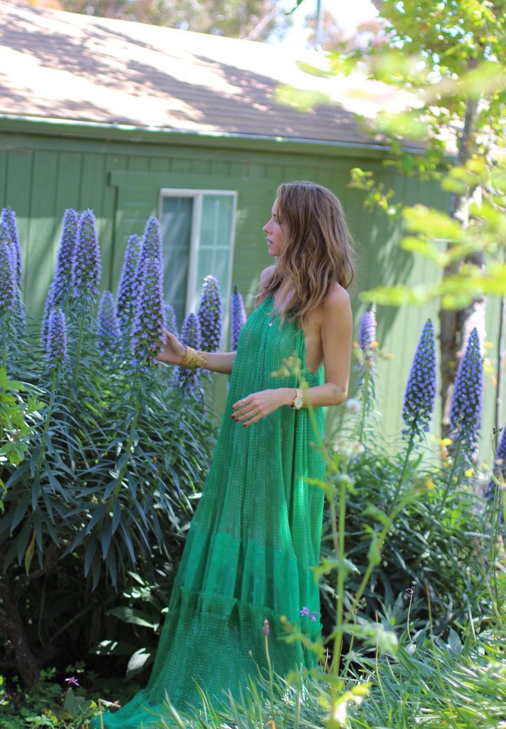 Los Angeles, MALIBU, April 2017, Model and Blogger Alexandra Lapp wearing Art Youth Society AYS jewelry, a green long JOY dress by Stella McCartney, bracelets from GAS Bijoux, a coin belt around the neck worn like a necklace and a IWC Da Vinci watch in red gold with diamonds in Malibu, Los Angeles, April 2017.