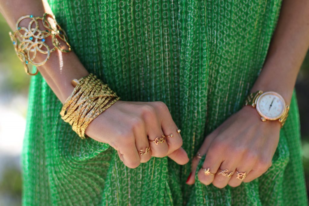 Los Angeles, MALIBU, April 2017, Model and Blogger Alexandra Lapp wearing Art Youth Society AYS jewelry, a green long JOY dress by Stella McCartney, bracelets from GAS Bijoux, a coin belt around the neck worn like a necklace and a IWC Da Vinci watch in red gold with diamonds in Malibu, Los Angeles, April 2017.