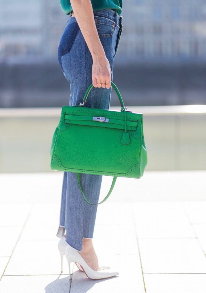 Kimono Love, Zara, Vetements, Christian Louboutin, AYS, Jadicted, Hermes, Kelly bag, Ray Ban Model and fashion blogger Alexandra Lapp has a Kimono Love, wearing a green flower printed kimono from Zara, a green tank top in silk, blue jeans from Vetements in cooperation with Levi´s with cut-out raw hems, white snake pumps from Christian Louboutin, Ray Ban Aviator sunglasses in green and a Hermes Kelly Ghillies 35 bag in green bamboo on March 30, 2017 in Duesseldorf, Germany.