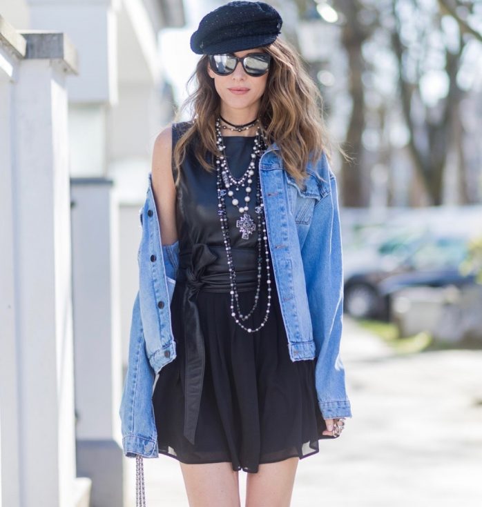 Model and fashion blogger Alexandra Lapp wearing a French Style, the Fergie dress from Tigha with a leather top and pleating skirt, a wide leather waist belt from SET, a Statement Jeans Jacket in a used look from SET, black Dior - Dio(r)evolution metal collier with palladium finish from Dior, three pearl necklaces from Chanel in black and white and little details, the Chanel milk bottle bag from the supermarket collection shaped like a milk carton with pearl-studded âlait de Cocoâ branding, black slingback leather pumps from Dior with JÂ´adior embroidery, Dior sunglasses and a crystal double ring from Guiseppe Zanotti. on March 30, 2017 in Duesseldorf, Germany.