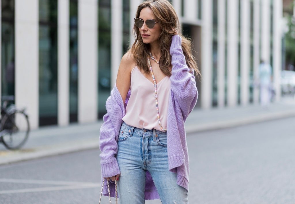 Heartbreaker, Christian Louboutin, Chanel, Levis, Jadicted, Karl, Karl Lagerfeld, Mercedes Benz Fashion Week Berlin, MBFWB, MBFW Alexandra Lapp wearing a pastel purple look, a purple cashmere cardigan by Heartbreaker, a rose tank top in silk from Jadicted, a high waist, non-strech denim, five-pocket 501 skinny jeans from Levis, a candy necklace from Chanel supermarket collection in pastel tones, a Chanel perfume bottle bag in plexiglass and a golden chain with white leather, Christian Louboutin pumps Feerica with nude mesh upper embedded with a Swarovski crystal degrade and Karl Lagerfeld cat-eye sunglasses in the shape of cat ears during the Mercedes-Benz Fashion Week Berlin Spring/Summer 2018 on July 7, 2017 in Berlin, Germany.