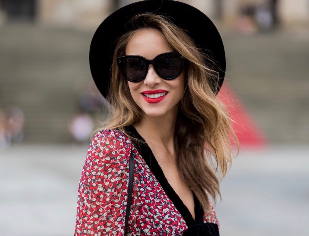 Alexandra Lapp wearing Boho Style, a red and cream floral print maxi dress from Philosophy di Lorenzo Serafini in sheer silk chiffon and bold black trims with a ribbon tie, Toubootfrou ankle boots with rete, organze and suede in black from Christian Louboutin, Celine Audrey sunglasses in black, Maison Maison Michel hat Virginie fedora, MCM Patricia Shoulder Bag in a vintage shape during the Mercedes-Benz Fashion Week Berlin Spring/Summer 2018 on July 7, 2017 in Berlin, Germany. Alexandra Lapp wearing Boho Style, a red and cream floral print maxi dress from Philosophy di Lorenzo Serafini in sheer silk chiffon and bold black trims with a ribbon tie, Toubootfrou ankle boots with rete, organze and suede in black from Christian Louboutin, Celine Audrey sunglasses in black, Maison Maison Michel hat Virginie fedora, MCM Patricia Shoulder Bag in a vintage shape during the Mercedes-Benz Fashion Week Berlin Spring/Summer 2018 on July 7, 2017 in Berlin, Germany.