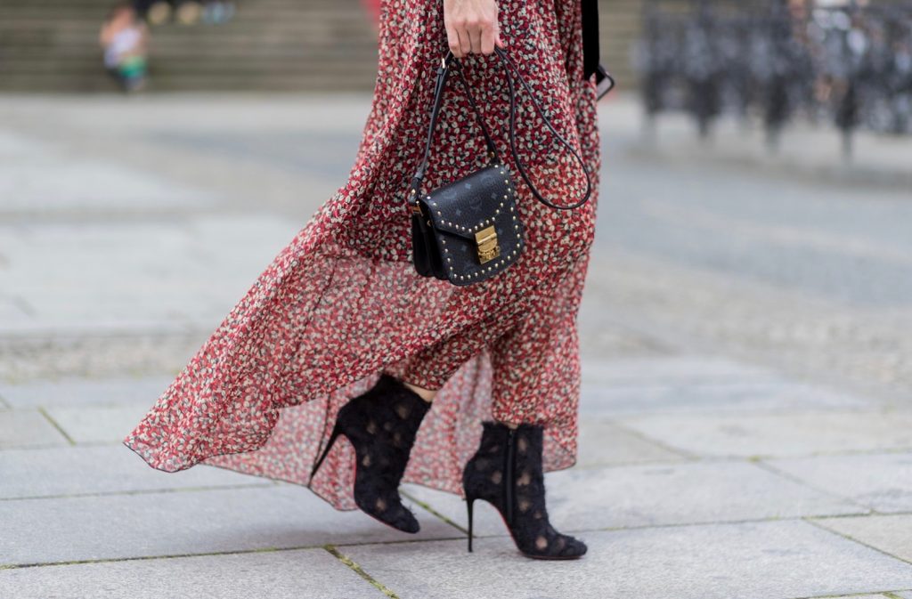 Alexandra Lapp wearing Boho Style, a red and cream floral print maxi dress from Philosophy di Lorenzo Serafini in sheer silk chiffon and bold black trims with a ribbon tie, Toubootfrou ankle boots with rete, organze and suede in black from Christian Louboutin, Celine Audrey sunglasses in black, Maison Maison Michel hat Virginie fedora, MCM Patricia Shoulder Bag in a vintage shape during the Mercedes-Benz Fashion Week Berlin Spring/Summer 2018 on July 7, 2017 in Berlin, Germany. Alexandra Lapp wearing Boho Style, a red and cream floral print maxi dress from Philosophy di Lorenzo Serafini in sheer silk chiffon and bold black trims with a ribbon tie, Toubootfrou ankle boots with rete, organze and suede in black from Christian Louboutin, Celine Audrey sunglasses in black, Maison Maison Michel hat Virginie fedora, MCM Patricia Shoulder Bag in a vintage shape during the Mercedes-Benz Fashion Week Berlin Spring/Summer 2018 on July 7, 2017 in Berlin, Germany.