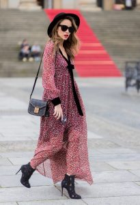Alexandra Lapp wearing Boho Style, a red and cream floral print maxi dress from Philosophy di Lorenzo Serafini in sheer silk chiffon and bold black trims with a ribbon tie, Toubootfrou ankle boots with rete, organze and suede in black from Christian Louboutin, Celine Audrey sunglasses in black, Maison Maison Michel hat Virginie fedora, MCM Patricia Shoulder Bag in a vintage shape during the Mercedes-Benz Fashion Week Berlin Spring/Summer 2018 on July 7, 2017 in Berlin, Germany. Alexandra Lapp wearing Boho Style, a red and cream floral print maxi dress from Philosophy di Lorenzo Serafini in sheer silk chiffon and bold black trims with a ribbon tie, Toubootfrou ankle boots with rete, organze and suede in black from Christian Louboutin, Celine Audrey sunglasses in black, Maison Maison Michel hat Virginie fedora, MCM Patricia Shoulder Bag in a vintage shape during the Mercedes-Benz Fashion Week Berlin Spring/Summer 2018 on July 7, 2017 in Berlin, Germany.