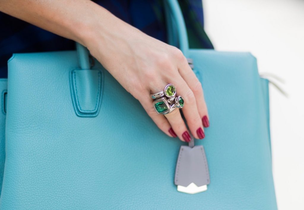 Model and fashion blogger Alexandra Lapp wearing a blue Kimono maxi dress with green leaf print from Borgo de Nor, green metallic Aviator sunglasses by Ray-Ban, plateau heels from Prada, Milla MCM bag in turquoise, a green bandana turban, neck ripe and bracelet in grey gold by Schubart Goldschmiede, three rings in grey gold with a green Tourmaline by Schubart on August 4, 2017 in Duesseldorf, Germany.