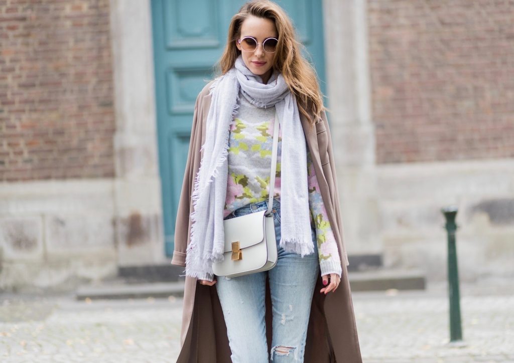Cashmere love for Model and fashion blogger Alexandra Lapp, who is wearing colorful cashmere pullover by Heartbreaker, high waist five-pocket 501 skinny jeans from Levis, cashmere scarf in grey by Heartbreaker, white snake pumps from Christian Louboutin, round sunglasses in white from Chrome Hearts, Celine Box bag in light grey and a big statement ring in rose gold with baguette diamonds by Schubart Goldschmiede on August 5, 2017 in Duesseldorf, Germany.