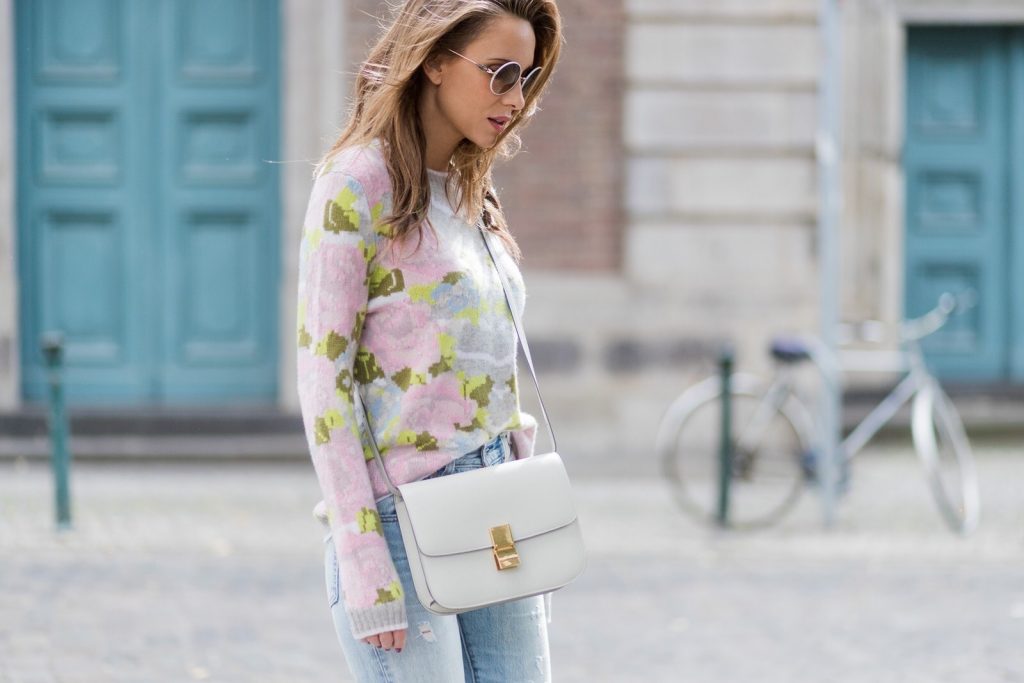 Cashmere love for Model and fashion blogger Alexandra Lapp, who is wearing colorful cashmere pullover by Heartbreaker, high waist five-pocket 501 skinny jeans from Levis, cashmere scarf in grey by Heartbreaker, white snake pumps from Christian Louboutin, round sunglasses in white from Chrome Hearts, Celine Box bag in light grey and a big statement ring in rose gold with baguette diamonds by Schubart Goldschmiede on August 5, 2017 in Duesseldorf, Germany.