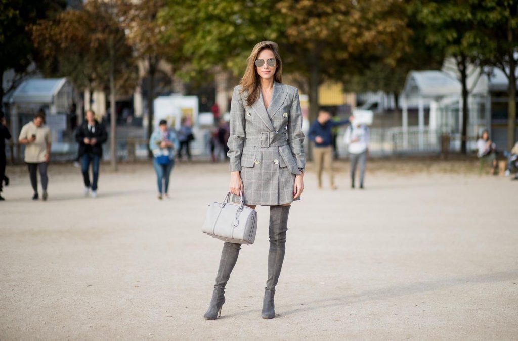 Alexandra Lapp wearing plaid blazer dress with a waist belt from Zara, the Essential Boston Bag with Monogramm in grey by MCM, silver mirrored sunglasses from le Specs, grey suede overknee boots by Gianvito Rossi is seen during Paris Fashion Week Spring/Summer 2018 on September 28, 2017 in Paris, France.