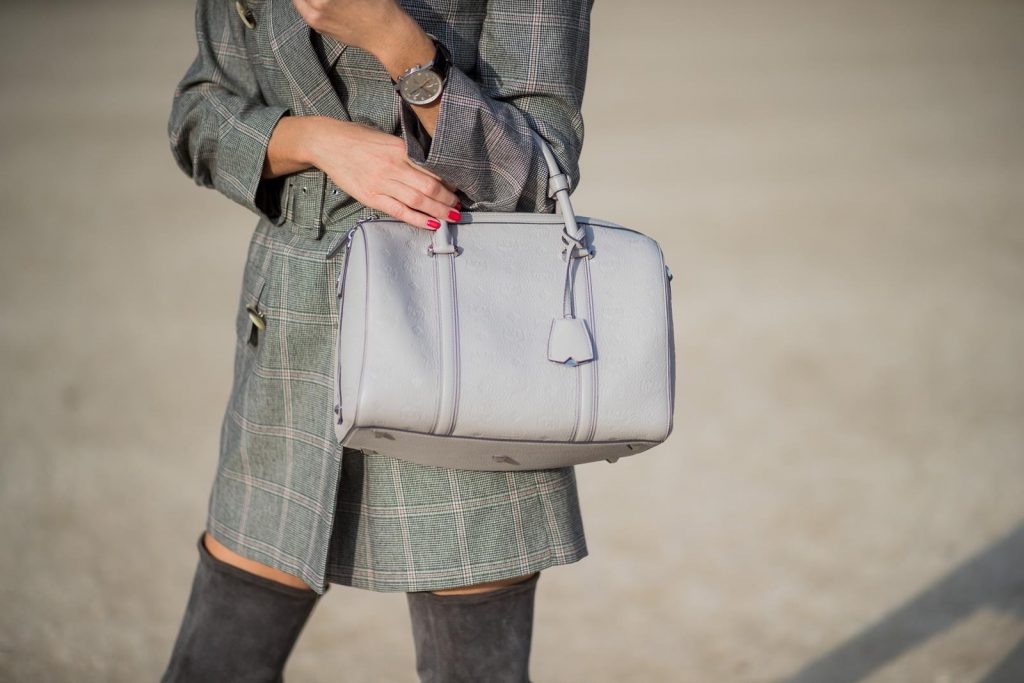 Alexandra Lapp wearing plaid blazer dress with a waist belt from Zara, the Essential Boston Bag with Monogramm in grey by MCM, silver mirrored sunglasses from le Specs, grey suede overknee boots by Gianvito Rossi is seen during Paris Fashion Week Spring/Summer 2018 on September 28, 2017 in Paris, France.