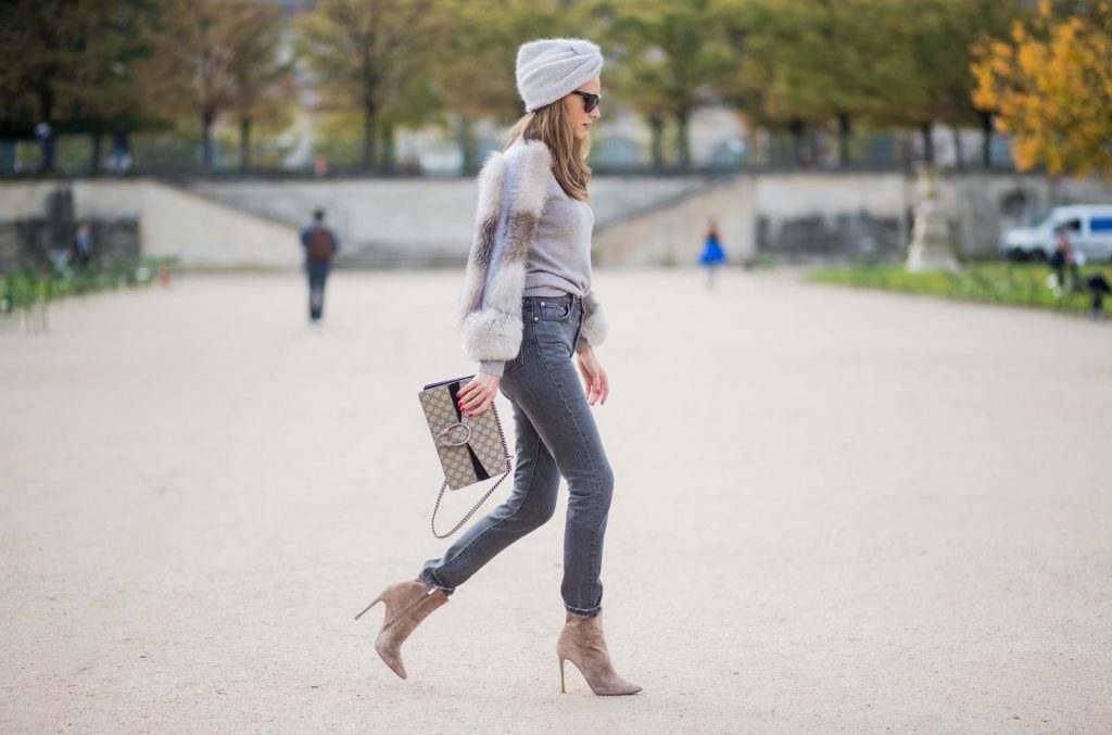 Alexandra Lapp wearing turban style in Paris, a cashmere turban from Falconeri, cashmere turtleneck pullover with fur sleeves from Falconeri, Levis 501 Skinny Fit jeans in black, sunglasses with pearls from Chanel, beige suede ankle boots by Gianvito Rossi and Dionysus GG Supreme shoulder bag from Gucci is seen during Paris Fashion Week Spring/Summer 2018 on September 29, 2017 in Paris, France.