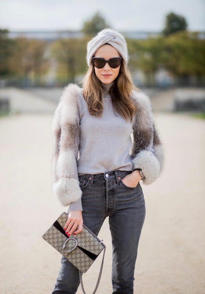 Alexandra Lapp wearing turban style in Paris, a cashmere turban from Falconeri, cashmere turtleneck pullover with fur sleeves from Falconeri, Levis 501 Skinny Fit jeans in black, sunglasses with pearls from Chanel, beige suede ankle boots by Gianvito Rossi and Dionysus GG Supreme shoulder bag from Gucci is seen during Paris Fashion Week Spring/Summer 2018 on September 29, 2017 in Paris, France.