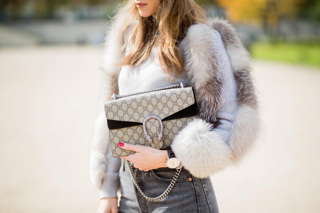 Alexandra Lapp wearing turban style in Paris, a cashmere turban from Falconeri, cashmere turtleneck pullover with fur sleeves from Falconeri, Levis 501 Skinny Fit jeans in black, sunglasses with pearls from Chanel, beige suede ankle boots by Gianvito Rossi and Dionysus GG Supreme shoulder bag from Gucci is seen during Paris Fashion Week Spring/Summer 2018 on September 29, 2017 in Paris, France.
