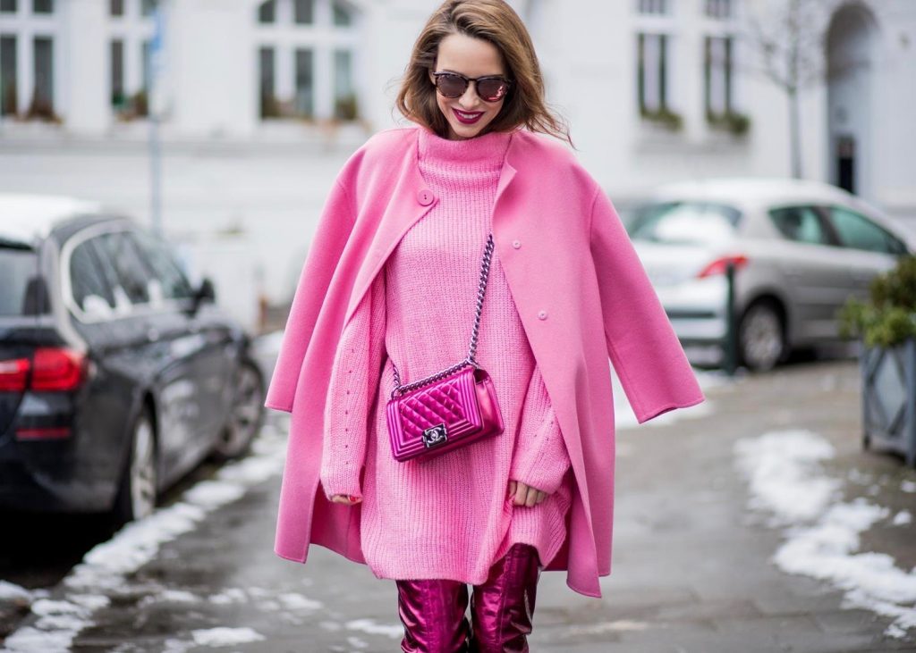 On Wednesdays we wear pink, Alexandra Lapp wearing overknee boots in metallic pink from Christian Louboutin, metallic pink Boy bag from Chanel, pink sunglasses from Le Specs, light pink knit dress from H&M and light pink cashmere coat from Prada on December 10, 2017 in Duesseldorf, Germany.