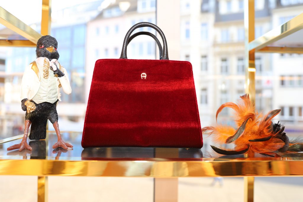 #AIGNERLOVE - Bonn, May 2018, Model and Blogger Alexandra Lapp at the re-opening Aigner store in Bonn, wearing an Alaïa dress in white, black an white Saint Laurent pumps and the it-bag Aigner Candice bag S in pink with black and white combined with the Love shoulder strap.