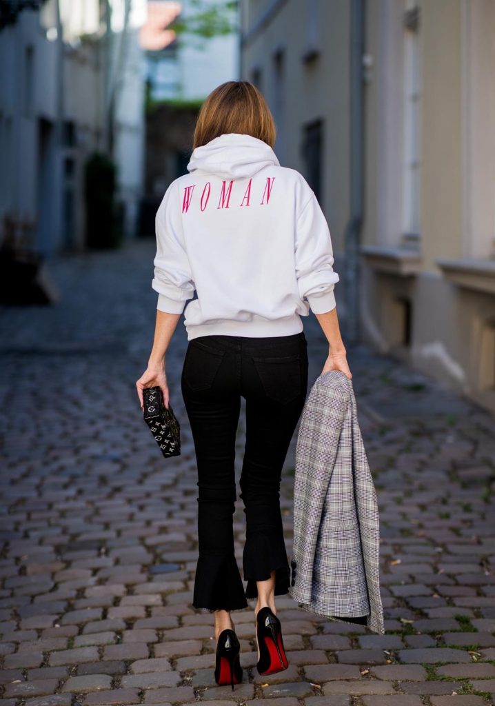 Off-White, Anine Bing, Mother, Christian Louboutin, Louis Vuitton, Dior Alexandra Lapp wearing the Off-White Hoodie c/o Virgil Abloh 0777 cotton Terry Hoodie in white, multicolored plaid Madeleine blazer by Anine Bing, the Cha Cha Fray flared pants in black by Mother, black patent leather pumps by Christian Louboutin, a black Petite Malle with silver accessories by Louis Vuitton and black Diormania sunglasses by Dior on May 6, 2018 in Duesseldorf, Germany.