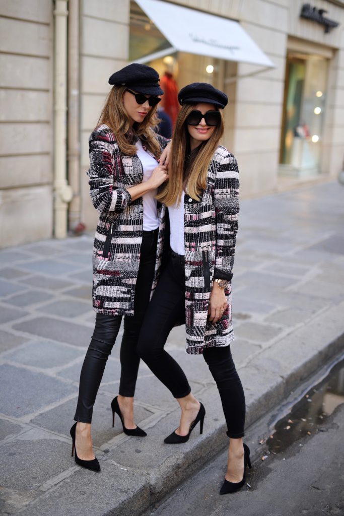 Alexandra Lapp in a Twinning Look with Lena Terlutter wearing a multi-colored Blazer Jacket in jersey jacquard by Airfield, black leather pants from Current Elliott, a simple white T-Shirt from Vince, vintage Chanel bakerboy cap in black, High Heels in black by Christian Louboutin and cat-eyed sunglasses in black by Illesteva.