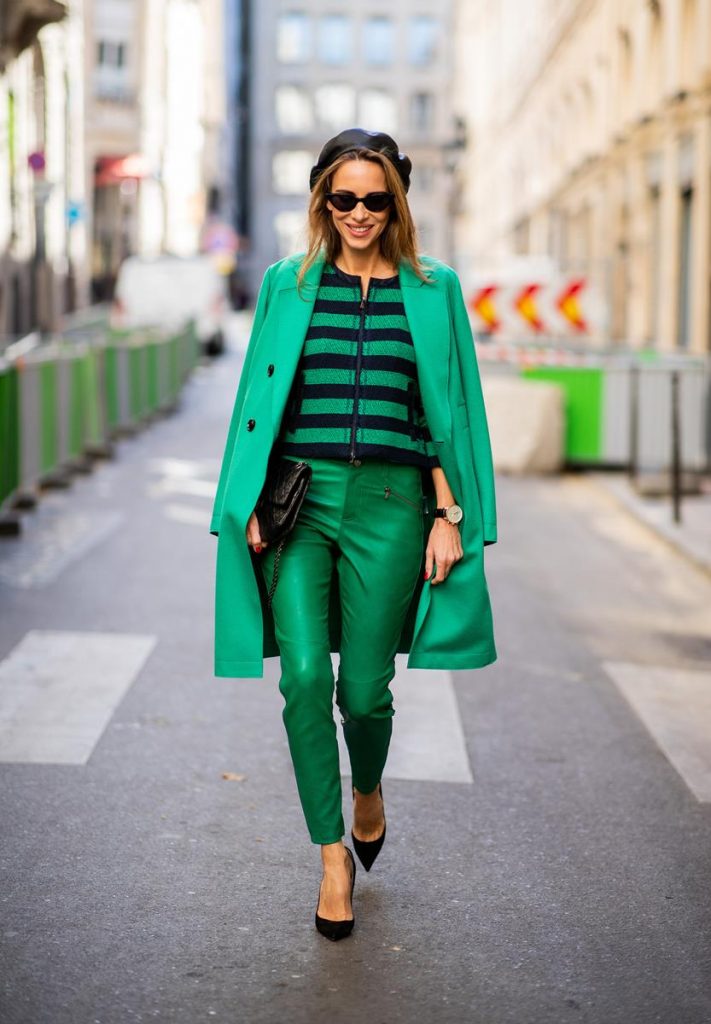 Alexandra Lapp in a Go Green Look wearing green skinny Riani leather pants, black green striped knit with a zipper by Riani, a green oversized blazer jacket by Riani, a black Chanel 2.55 flap bag, black suede Christian Louboutin high heels, cat-eye shaped Isabella Sunglasses by illesteva and a black Eugenia Kim beret during Paris Fashion Week Womenswear Spring/Summer 2019 on September 27, 2018 in Paris, France.