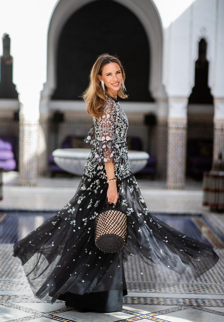 Alexandra Lapp at La Mamounia wearing a Dragonfly Garden embellished tulle and crepe de chine maxi dress in black and silver by Needle & Thread, black pumps Flower Strass Buckle from Roger Vivier and long silver strass earrings by H&M on November 27, 2018 in Marrakech, Morocco.