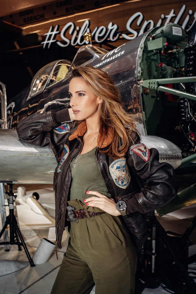 Alexandra Lapp in a Silver Spitfire Look, wearing a IWC Spitfire watch while visiting the IWC Schaffhausen booth at the SIHH 2019 in Geneva.