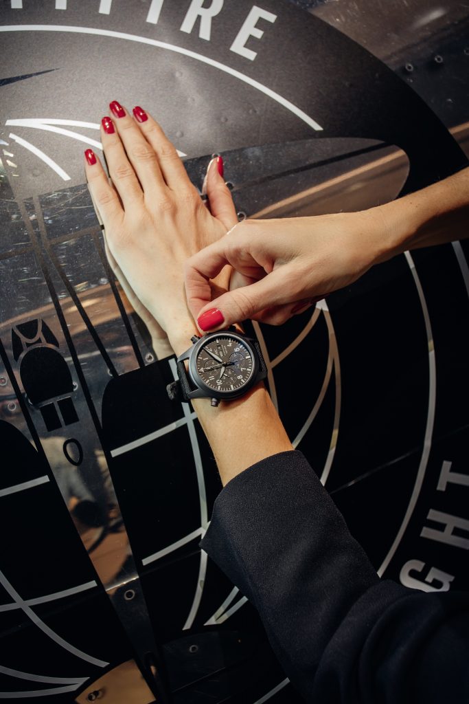 Alexandra Lapp in a Silver Spitfire Look, wearing a IWC Spitfire watch while visiting the IWC Schaffhausen booth at the SIHH 2019 in Geneva.