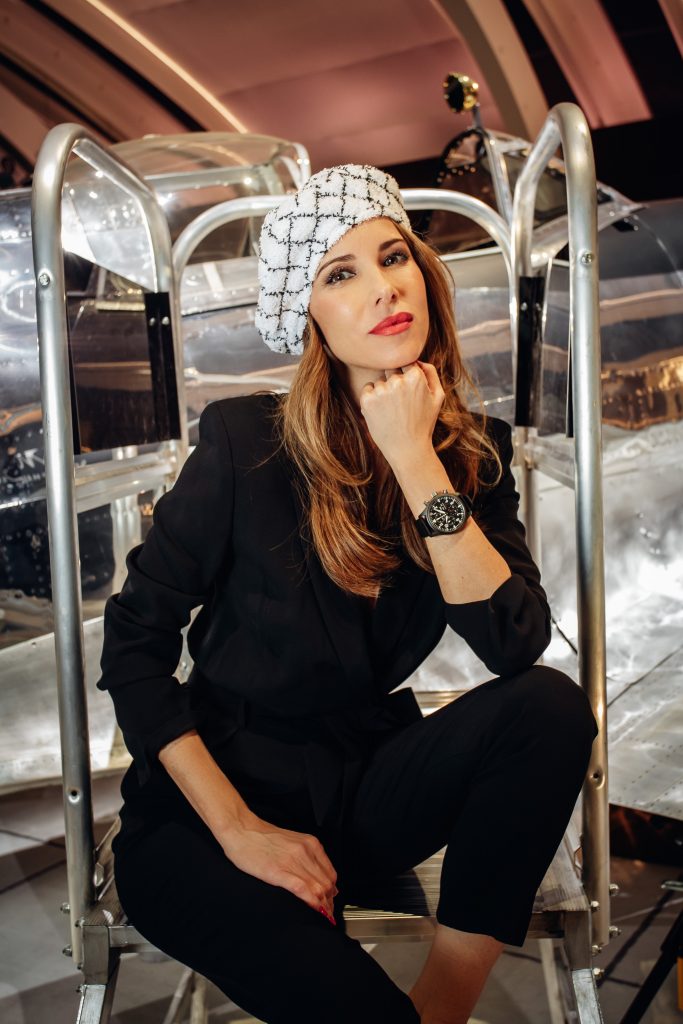 Alexandra Lapp in a Silver Spitfire Look, wearing a IWC Spitfire watch while visiting the IWC Schaffhausen booth at the SIHH 2019 in Geneva.