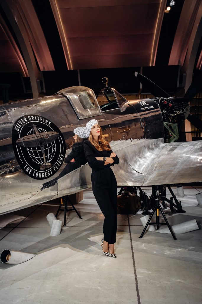 Alexandra Lapp in a Silver Spitfire Look, wearing a IWC Spitfire watch while visiting the IWC Schaffhausen booth at the SIHH 2019 in Geneva.