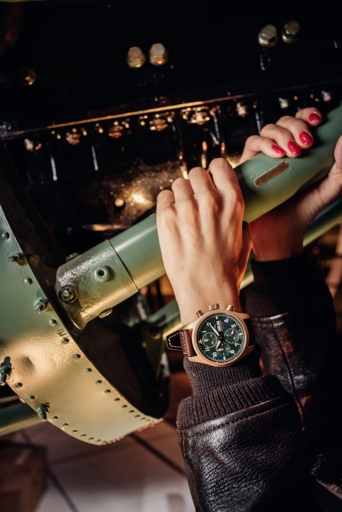 Alexandra Lapp in a Silver Spitfire Look, wearing a IWC Spitfire watch while visiting the IWC Schaffhausen booth at the SIHH 2019 in Geneva.