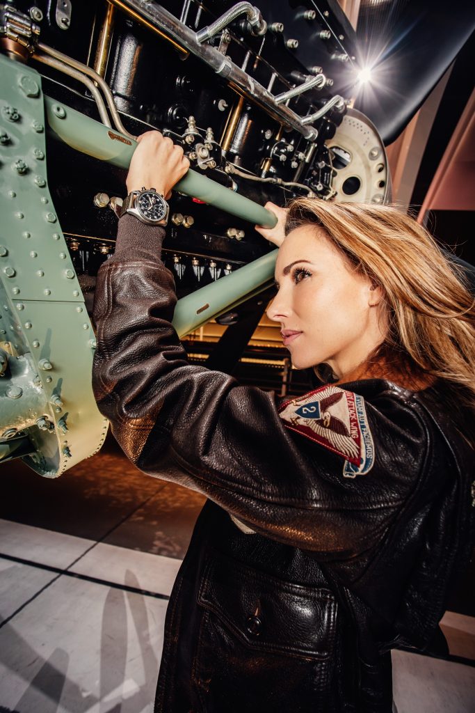 Alexandra Lapp in a Silver Spitfire Look, wearing a IWC Spitfire watch while visiting the IWC Schaffhausen booth at the SIHH 2019 in Geneva.