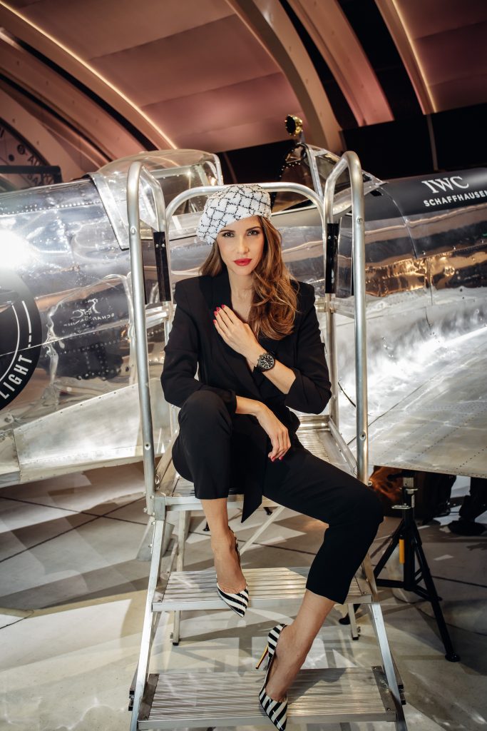 Alexandra Lapp in a Silver Spitfire Look, wearing a IWC Spitfire watch while visiting the IWC Schaffhausen booth at the SIHH 2019 in Geneva.