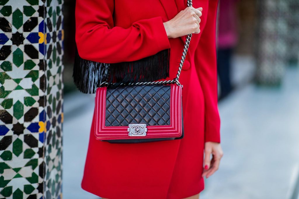 Alexandra Lapp in a red Blazer dress look wearing a red blazer dress with fringes at both arms from Pearl and Rubies, black Cowboy boots with a silver tip from Isabel Marant, red and black boy bag from Chanel and oversized sunglasses from Chloe on November 25, 2018 in Marrakech, Morocco. (Photo by Christian Vierig/Getty Images)